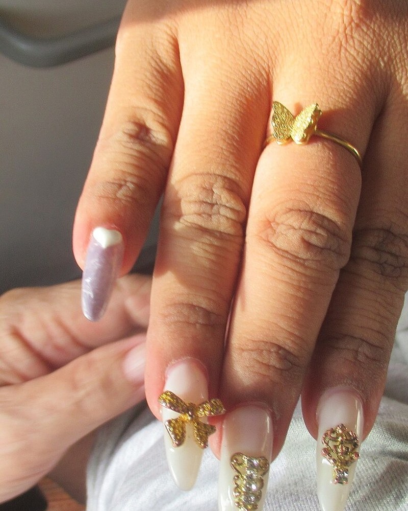 Gold Charm Stiletto Nails